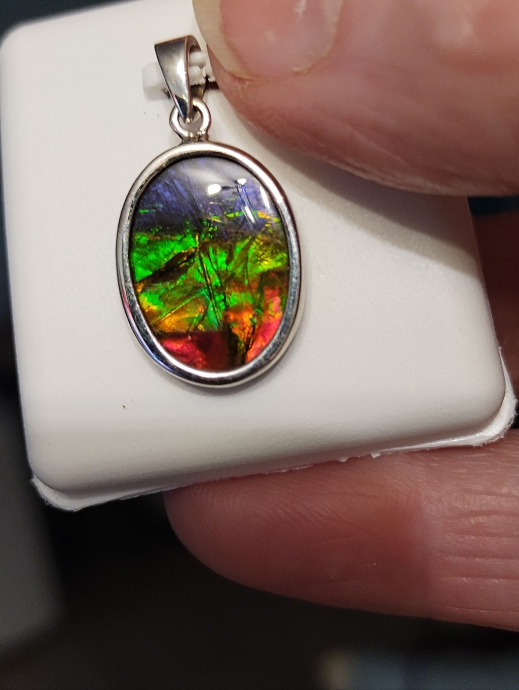 Silver Ammolite Oval Pendant In Green-Red Iridescence